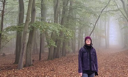Gina Crane standing in the woods