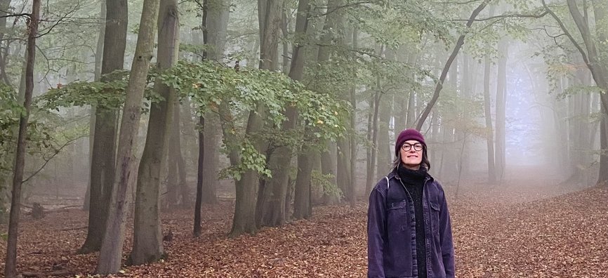 Gina Crane standing in the woods