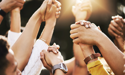 People holding hands - support
