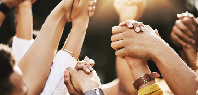People holding hands - support
