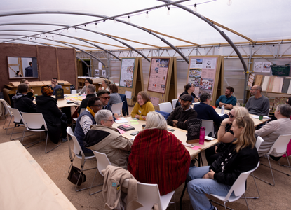 Groups of people convened by Esmée Fairbairn Foundation and Civic Square sat around tables having a discussion.