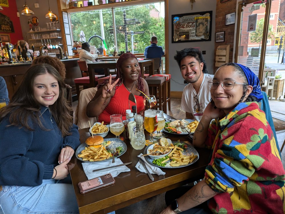 Members of the Involving Young People Collective having a meal during a Blue Spaces site visit.