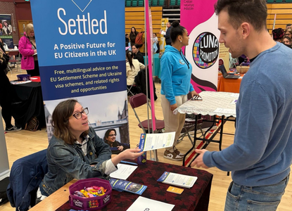 Settled providing outreach at a jobs fair in Cardiff